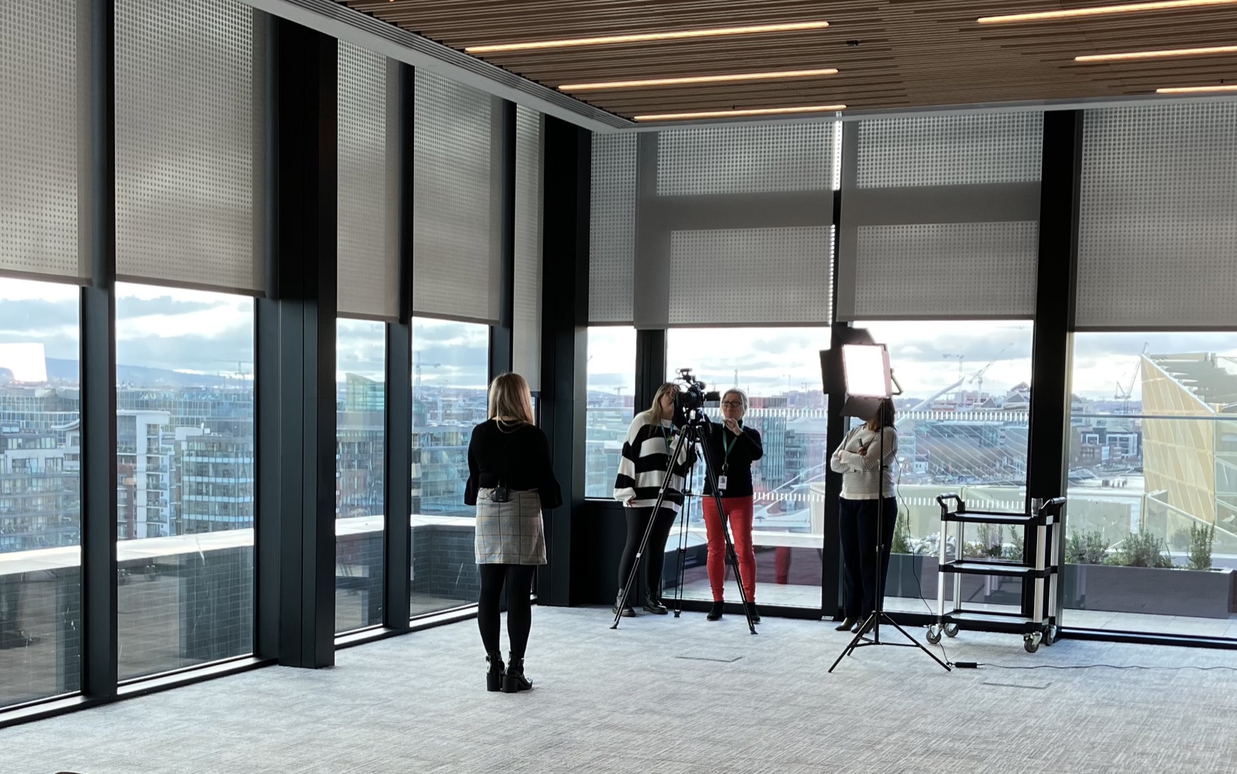 A marketing team being trained to film an interview in a Dublin office